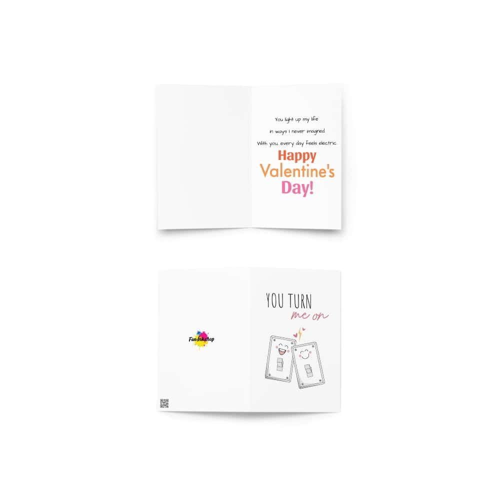 A folded Valentine's Day card featuring a cute illustration of two smiling light switches with the phrase "You Turn Me On" on the front. Inside, a romantic message reads: "You light up my life in ways I never imagined. With you, every day feels electric. Happy Valentine’s Day!"