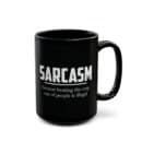 A black ceramic mug with bold white text that reads: "Sarcasm – because beating the crap out of people is illegal."